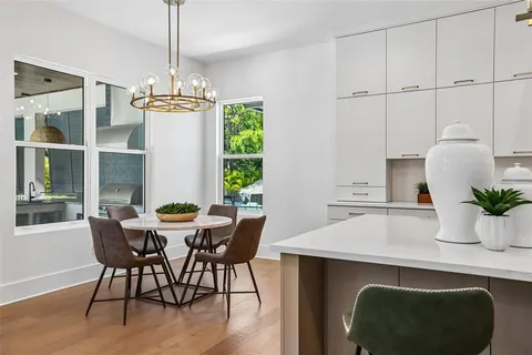 a spacious bathroom with a granite countertop sink and a mirror