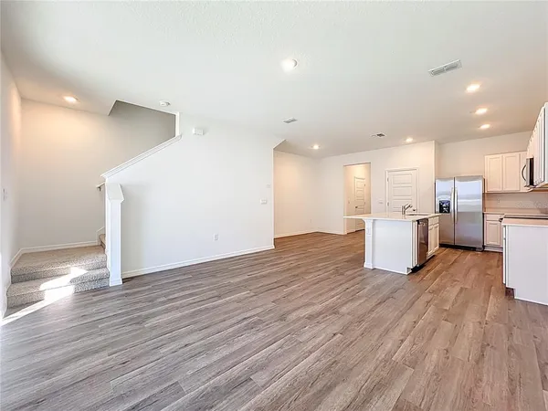 a view of kitchen with wooden floor