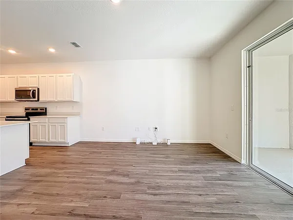 a view of kitchen with wooden floor