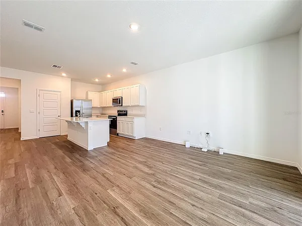 a view of kitchen with wooden floor