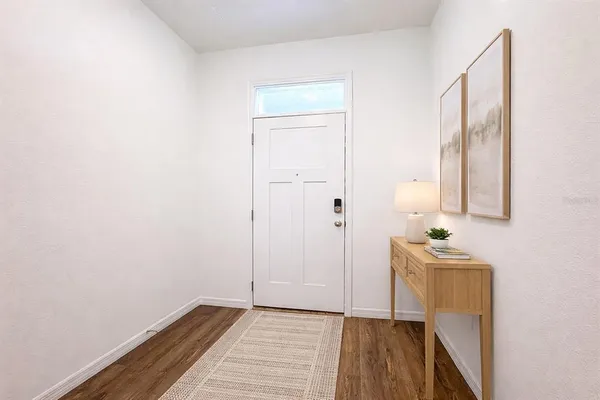 a bathroom with a sink a mirror and a window
