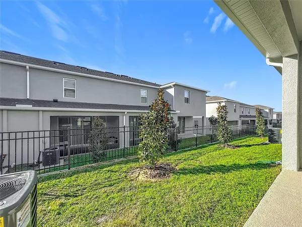 a view of a large building with a palm tree