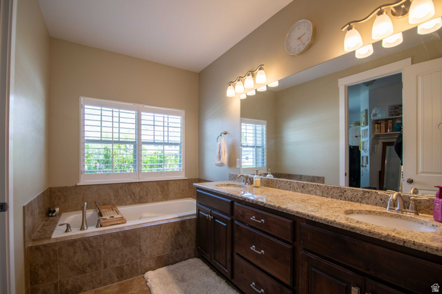 646 East 1400th Street North Mapleton, UT 84664 - Photo 31 of 78 Double vanity with granite-style countertops, undermount sinks, and brushed nickel fixtures