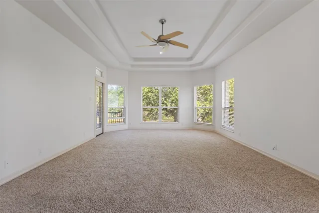 a spacious bathroom with a granite countertop sink and a mirror