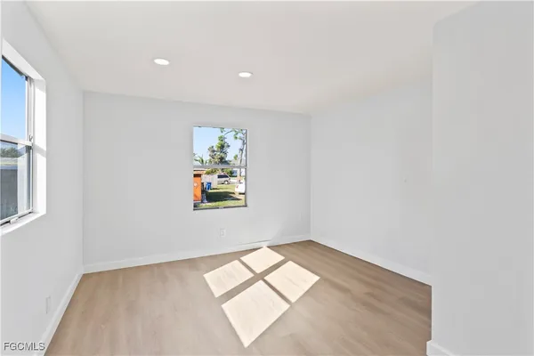 an empty room with windows