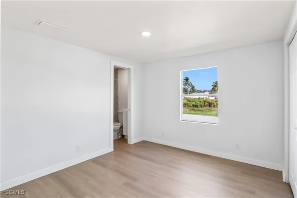 an empty room with windows and window