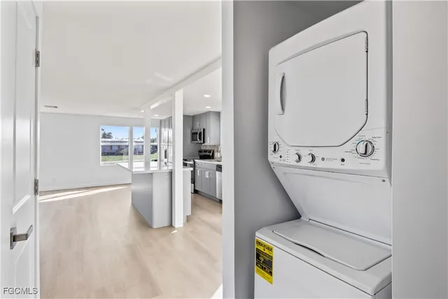 a view of kitchen with furniture and refrigerator