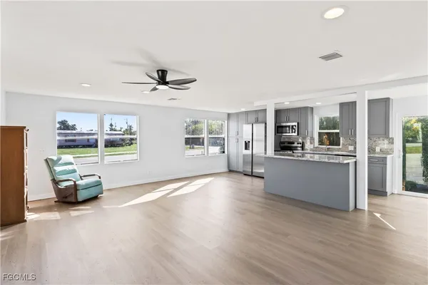 a living room with furniture and window