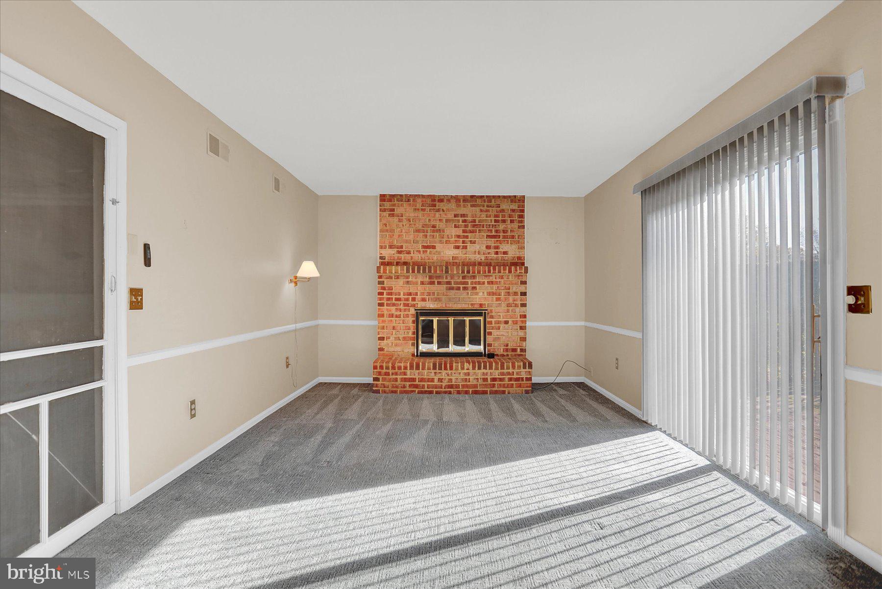 156 Chester Street Carlisle, PA 17013 - Photo 15 of 36 a view of an empty room with wooden floor and a window