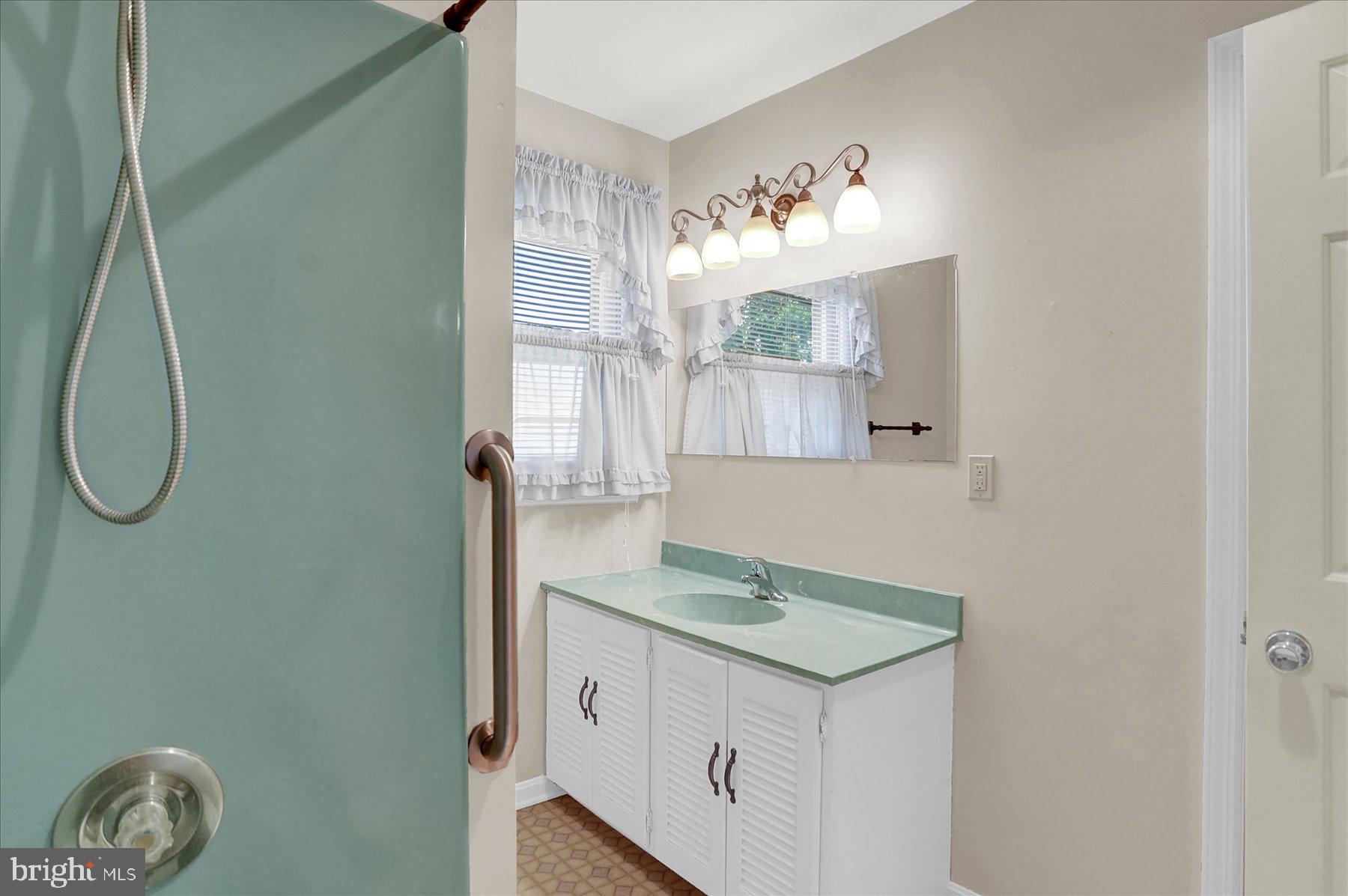 156 Chester Street Carlisle, PA 17013 - Photo 23 of 36 a bathroom with a granite countertop sink and a mirror