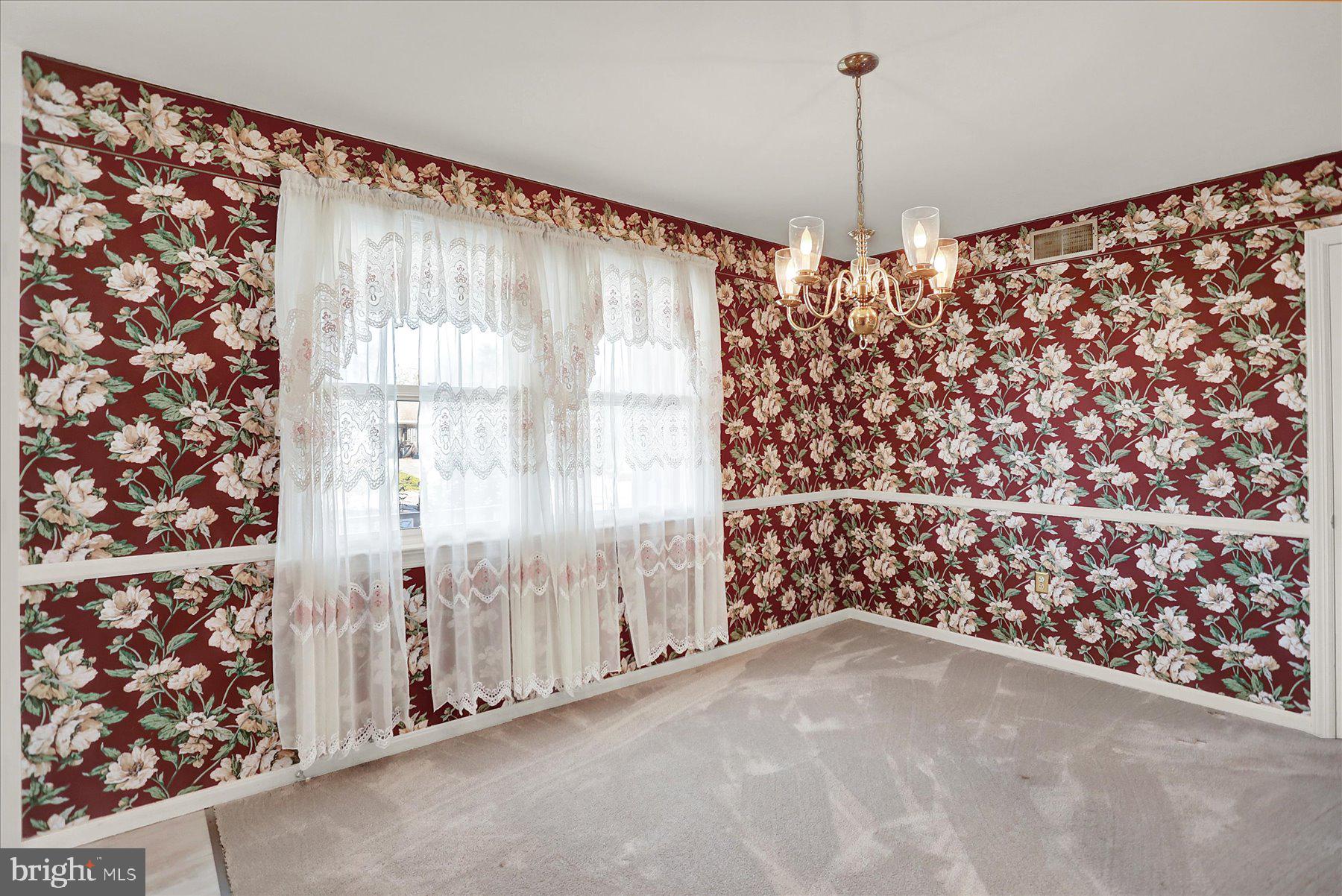 156 Chester Street Carlisle, PA 17013 - Photo 9 of 36 a view of a big room with windows and chandelier fan