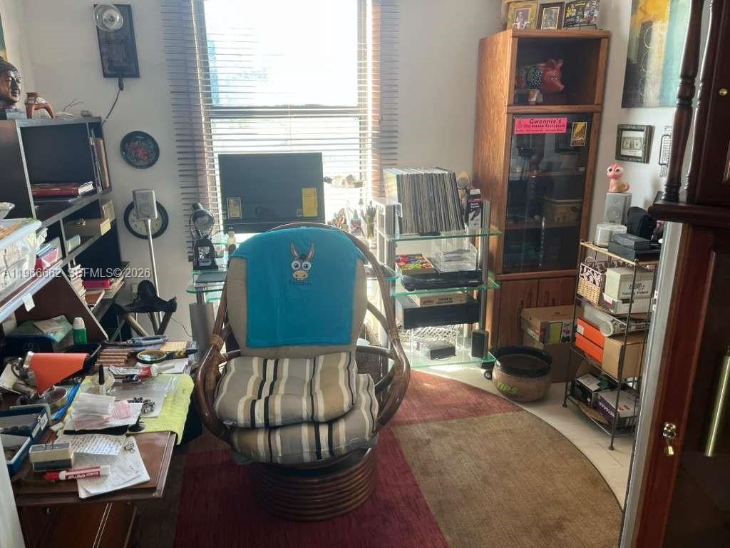 360 South Brida Street Clewiston, FL 33440 - Photo 11 of 14 a living room with furniture and a window