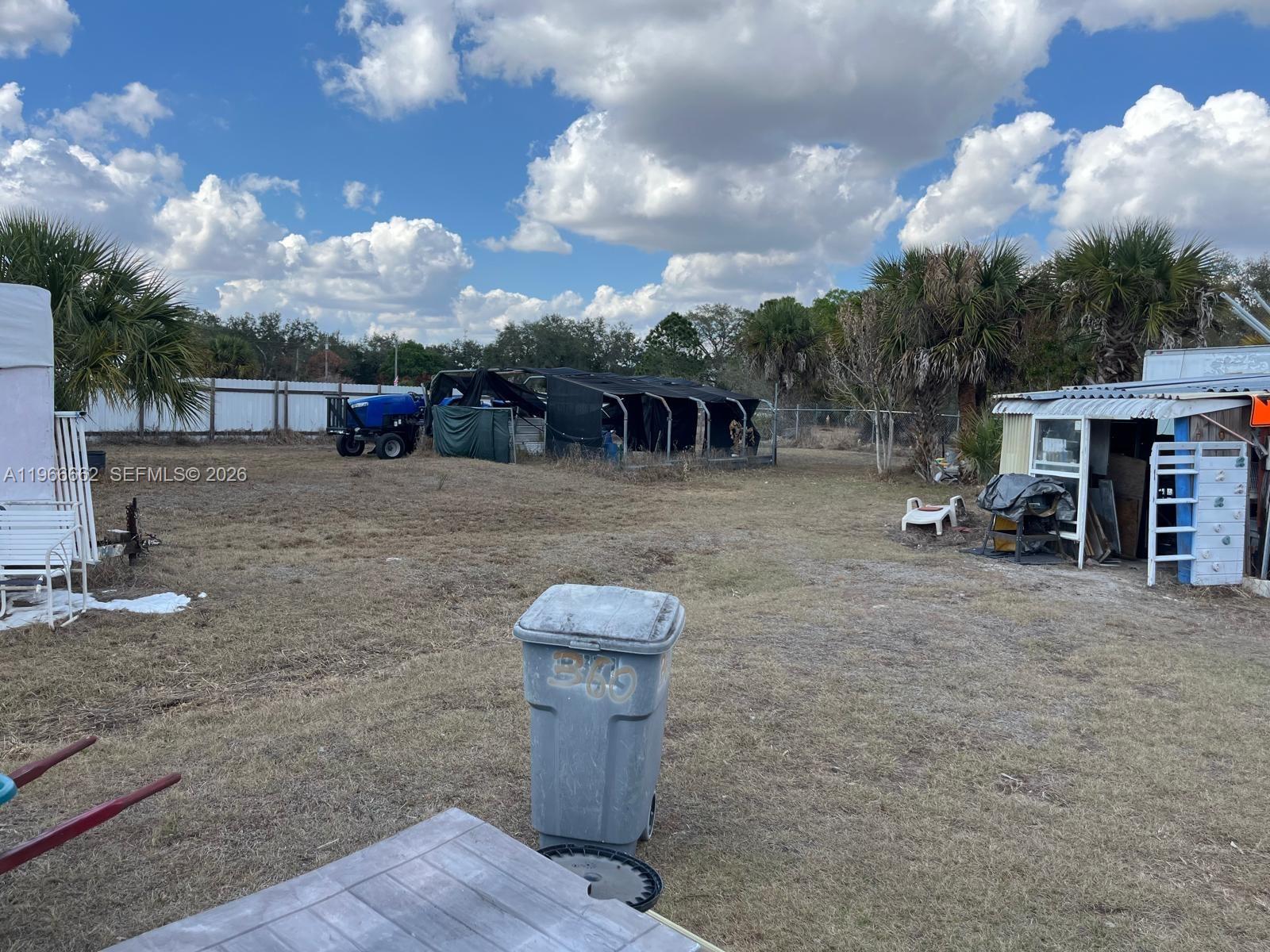 360 South Brida Street Clewiston, FL 33440 - Photo 5 of 14 a view of a backyard