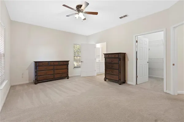 a view of an empty room with closet