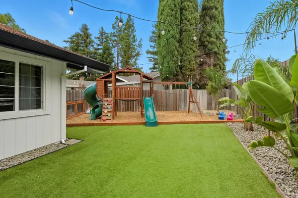 a view of a park with swings and slides