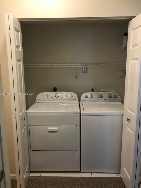 2469 Centergate Drive, Unit 203 Miramar, FL 33025 - Photo 11 of 13 a utility room with dryer and washer