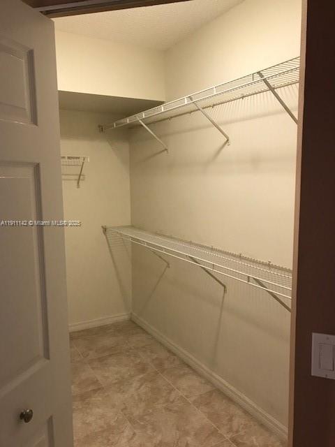2469 Centergate Drive, Unit 203 Miramar, FL 33025 - Photo 10 of 13 a view of a room with racks on the wall