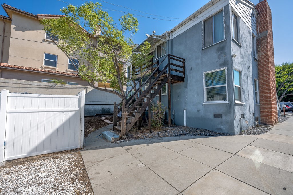711 North Howard Street Glendale, CA 91206 - Photo 16 of 20 a backyard of a house with large trees and barbeque oven