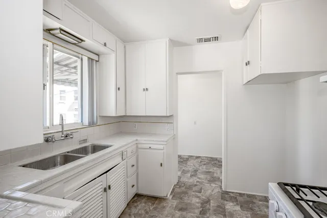 a view of a kitchen with a sink
