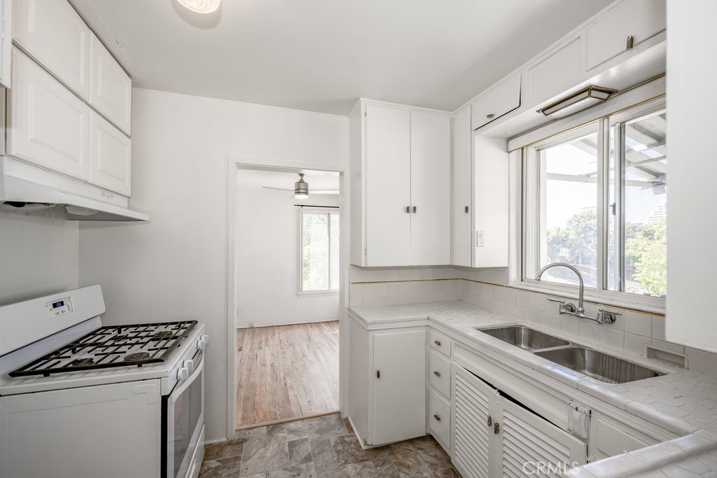 711 North Howard Street Glendale, CA 91206 - Photo 8 of 20 a kitchen that has a sink and a stove