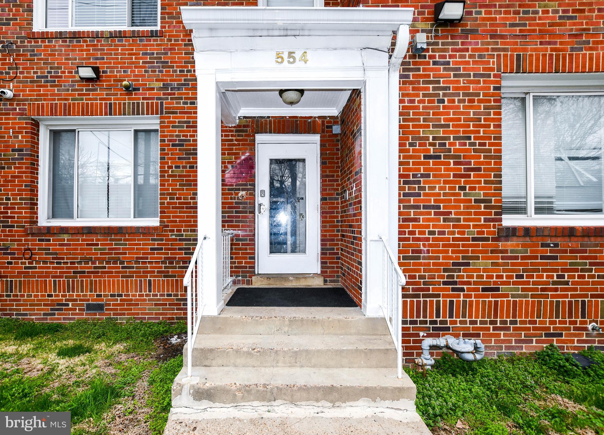 554 Newcomb Street Southeast, Unit 4 Washington, DC 20032 - Photo 32 of 34 a view of a brick house with a large windows