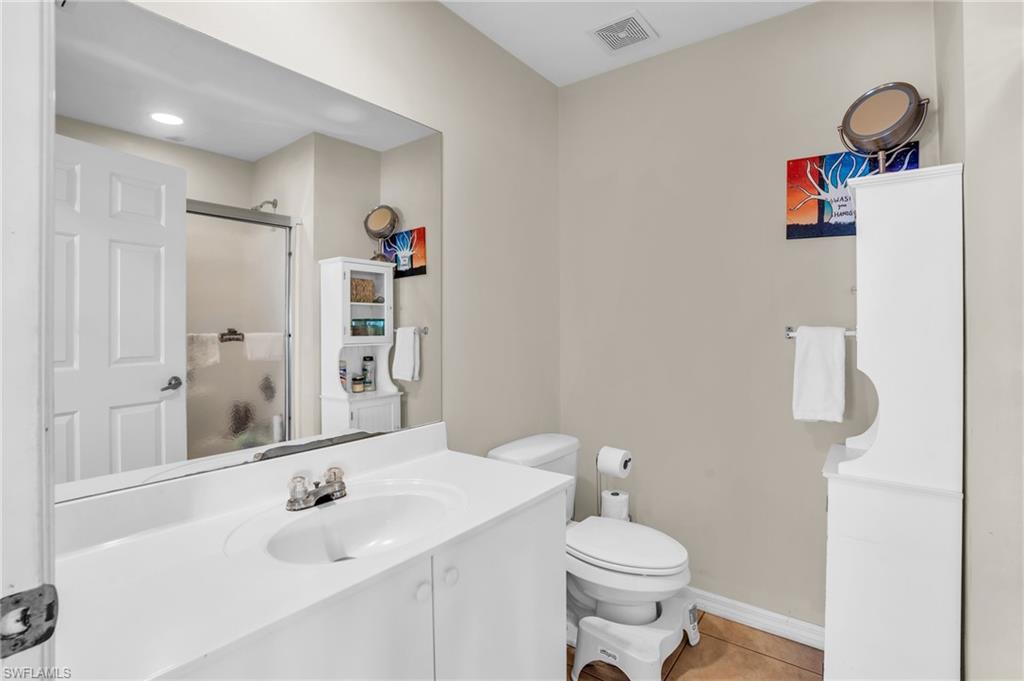 2388 55th Terrace Southwest Naples, FL 34116 - Photo 15 of 42 Bathroom with tile floors, vanity, and toilet