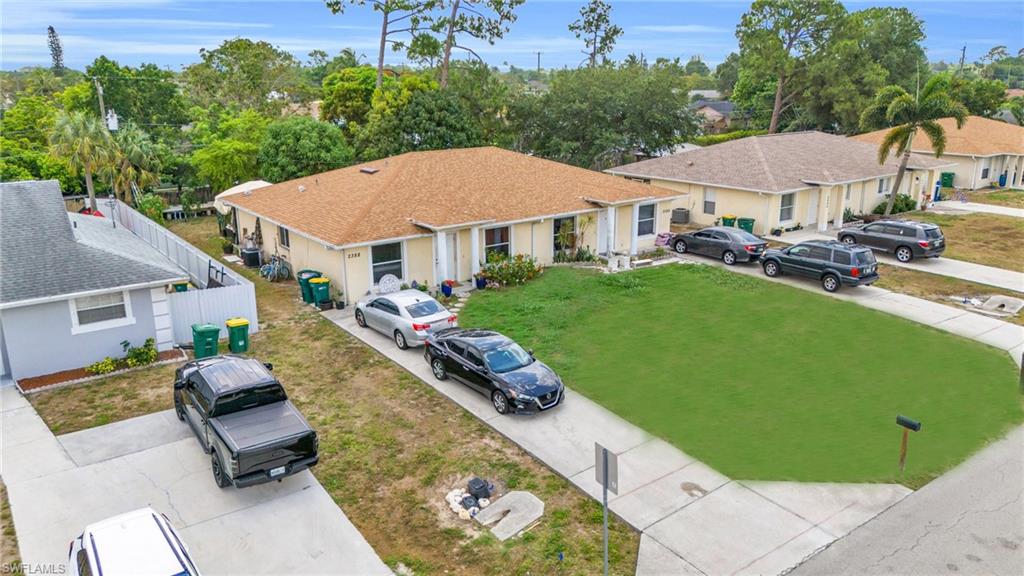 2388 55th Terrace Southwest Naples, FL 34116 - Photo 3 of 42 View of front of house featuring a front lawn