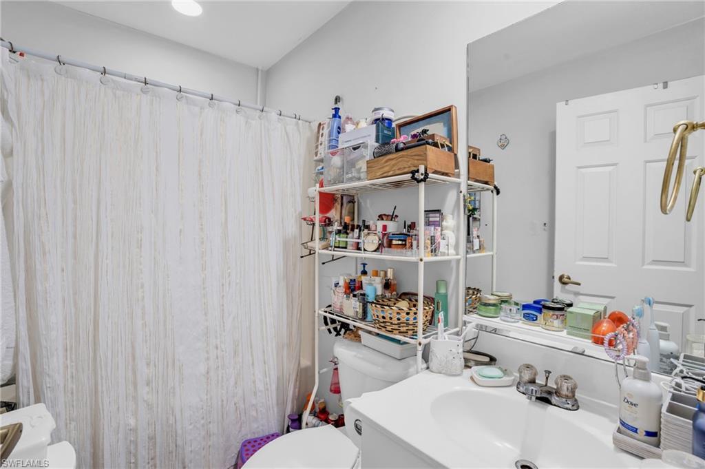 2388 55th Terrace Southwest Naples, FL 34116 - Photo 32 of 42 Bathroom with toilet and large vanity