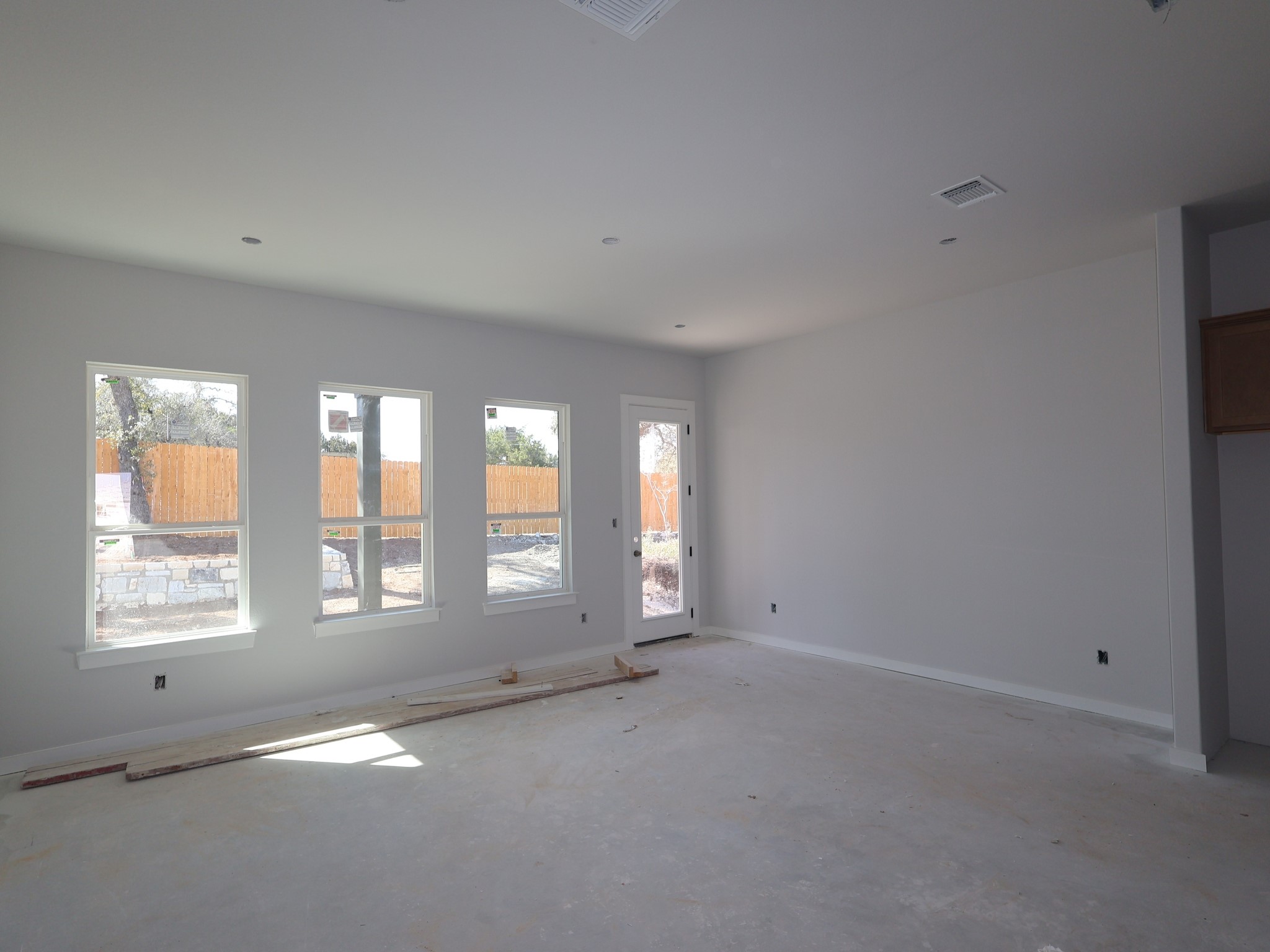 474 Bishop Wood Road Dripping Springs, TX 78620 - Photo 5 of 15 a view of an empty room with a window