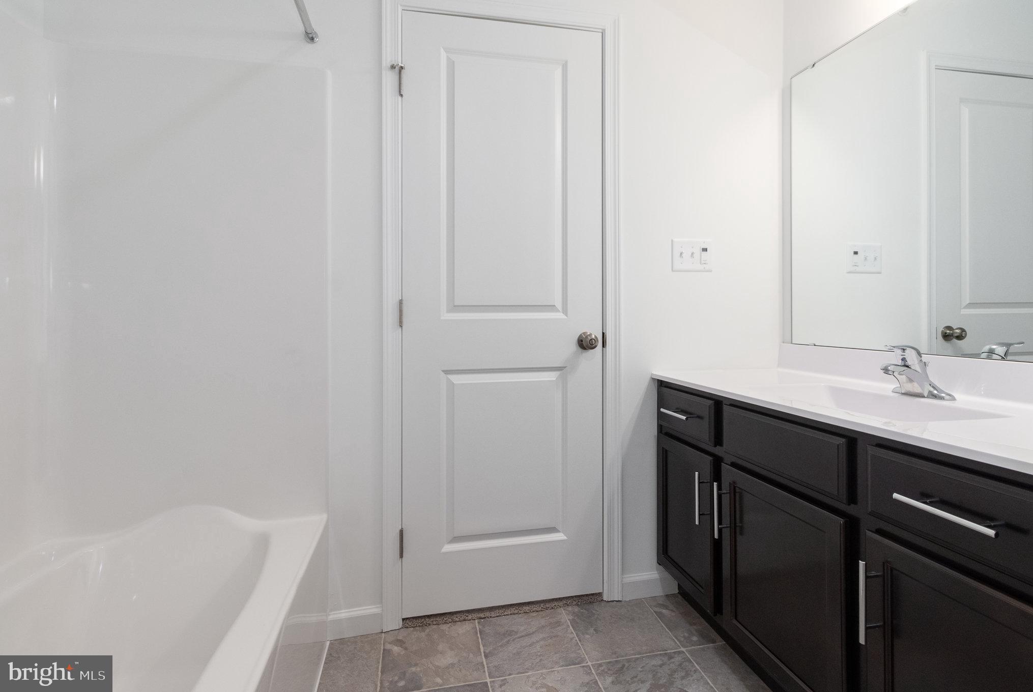 104 Emma Circle Harrisburg, PA 17112 - Photo 22 of 29 a bathroom with a sink and a bathtub