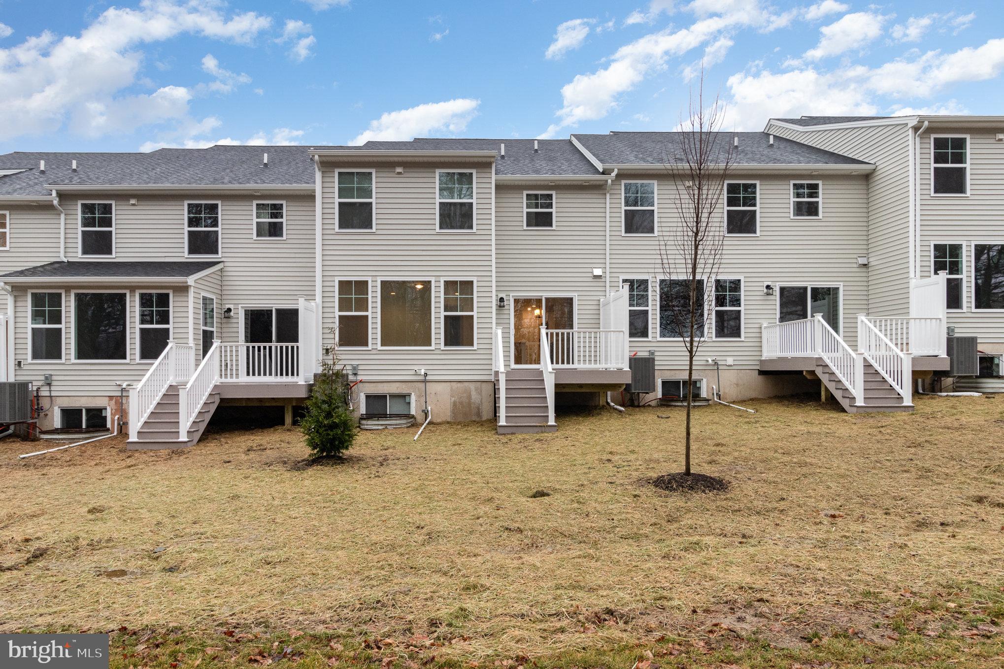 104 Emma Circle Harrisburg, PA 17112 - Photo 26 of 29 a blue house with trees in front of it