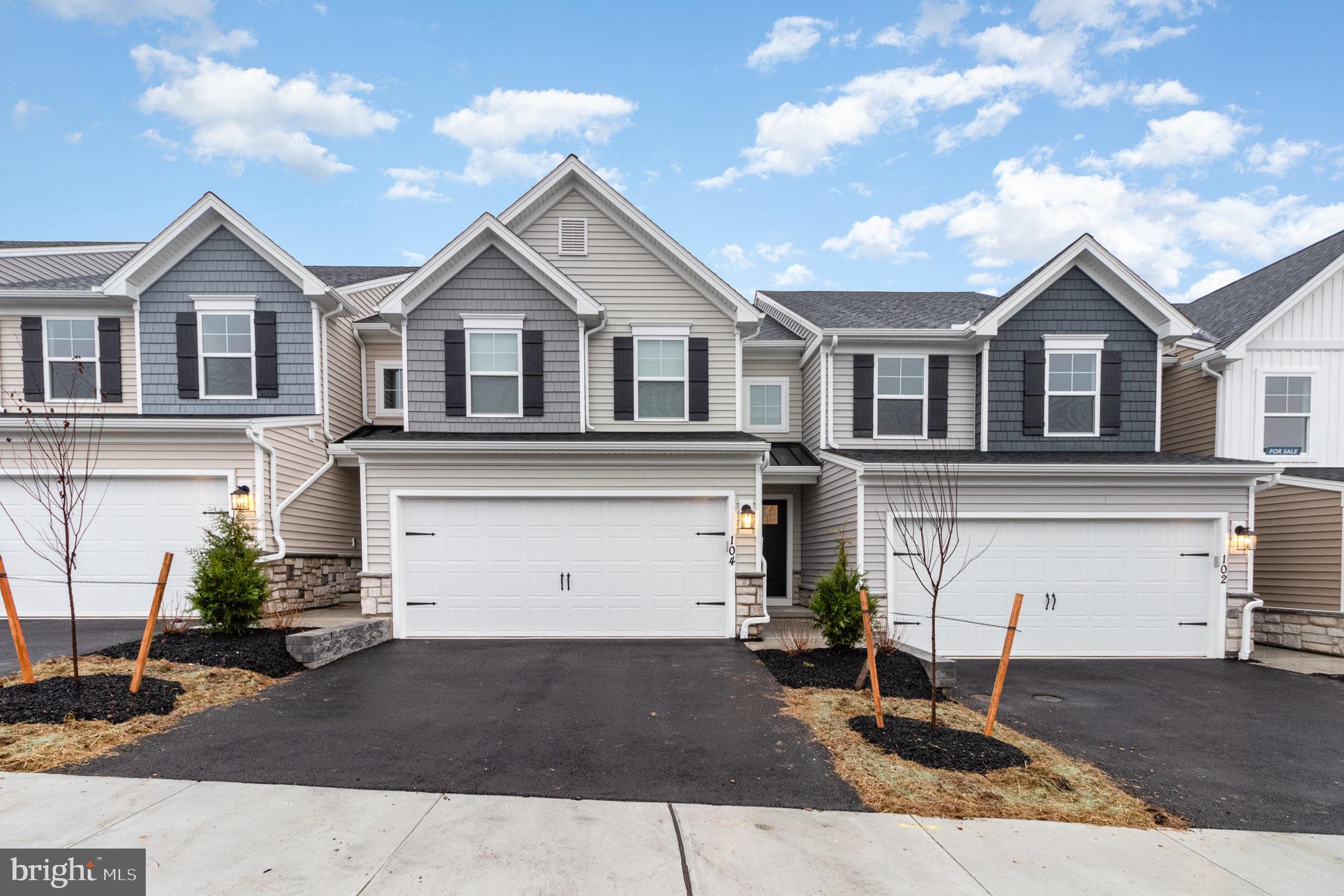104 Emma Circle Harrisburg, PA 17112 - Photo 3 of 29 a front view of a house with a yard and garage