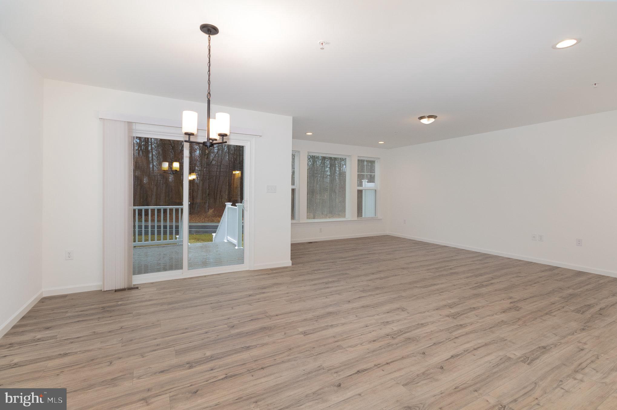 104 Emma Circle Harrisburg, PA 17112 - Photo 8 of 29 a view of a room with wooden floor kitchen and window