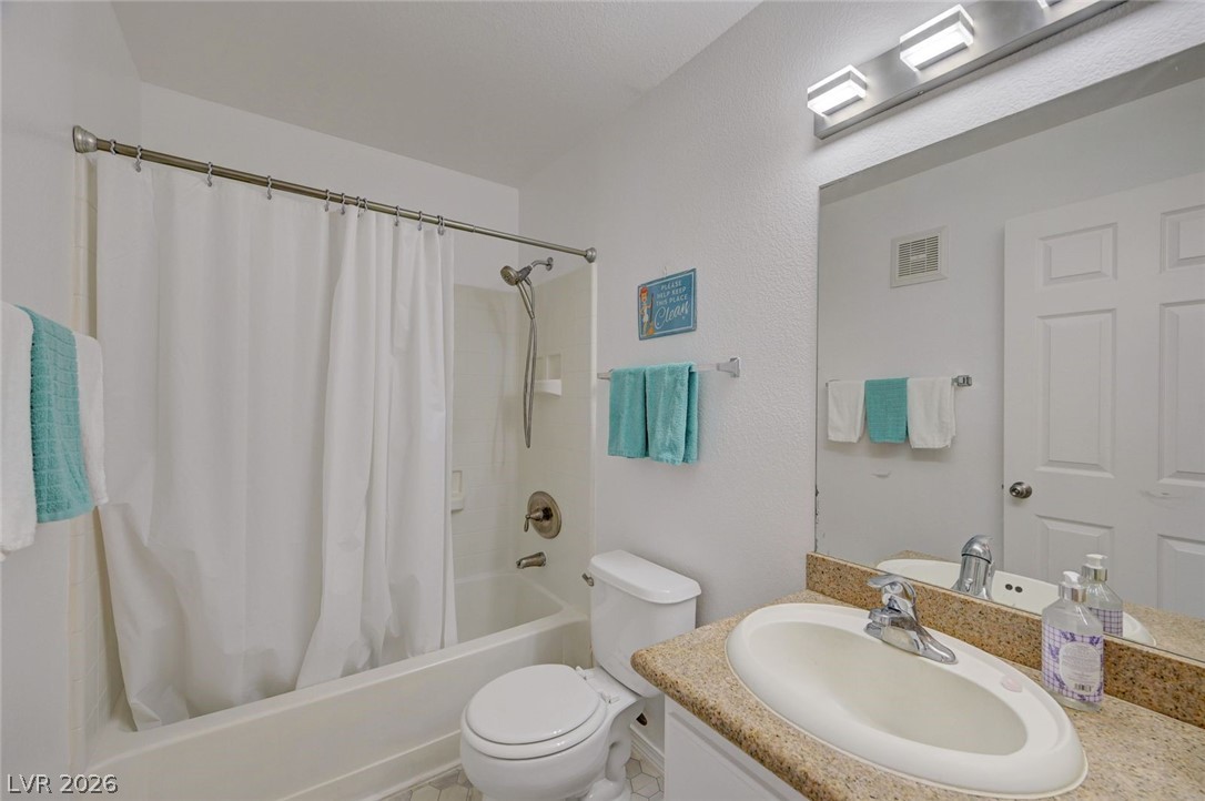 3318 North Decatur Boulevard, Unit 2072 Las Vegas, NV 89130 - Photo 27 of 50 Functional bathroom featuring a tub-shower combination, a vanity with ample counter space, and integrated lighting for everyday convenience.