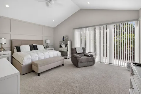 a bedroom with bed and a couch