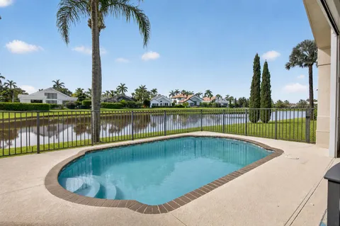 a view of a swimming pool with a lake