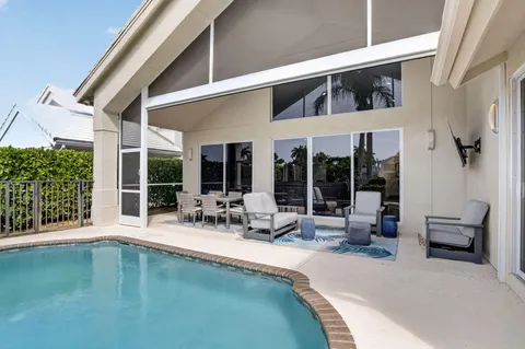 a view of swimming pool with outdoor seating