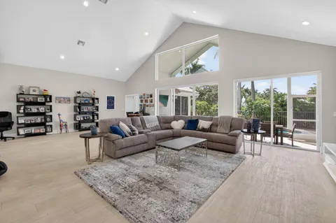 a living room with furniture and large window