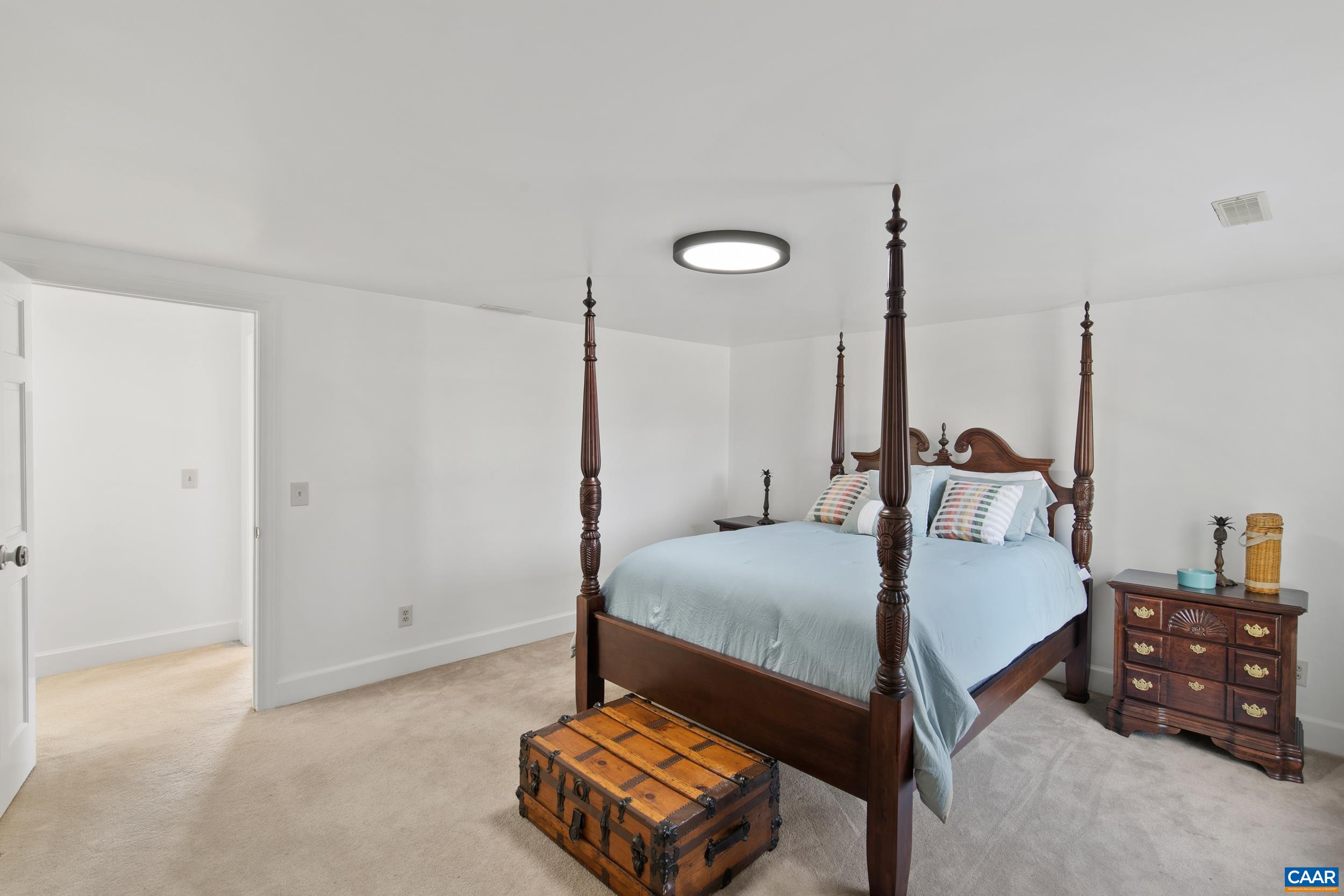6883 Porters Road Esmont, VA 22937 - Photo 34 of 67 a bed room with a bed window and a table