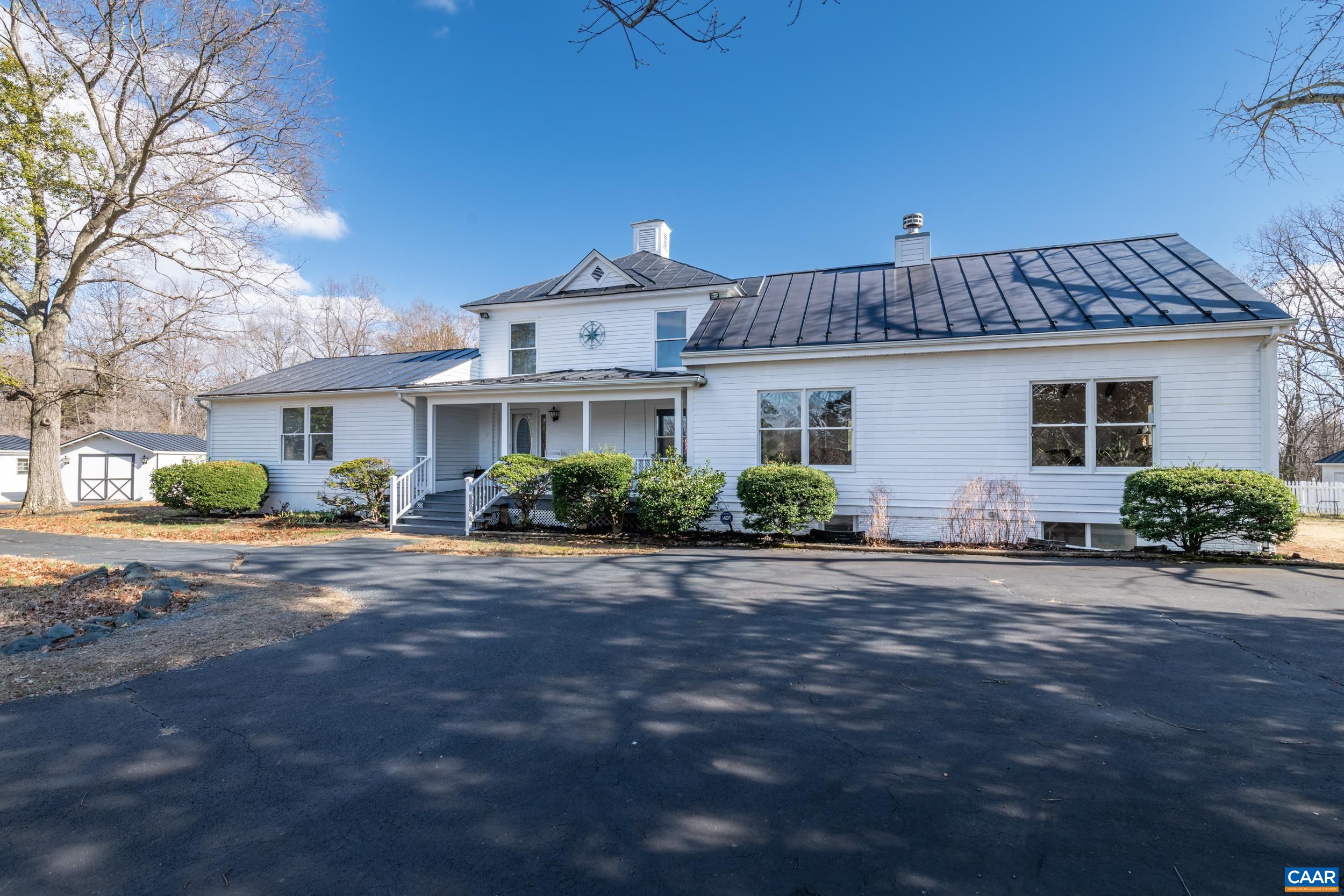 6883 Porters Road Esmont, VA 22937 - Photo 56 of 67 a front view of a house with a yard