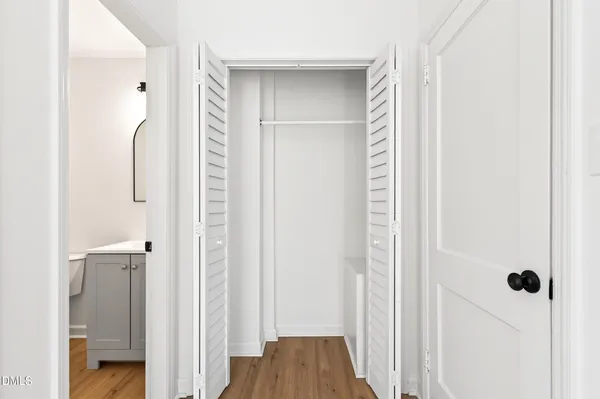 a view of a bathroom from a hallway