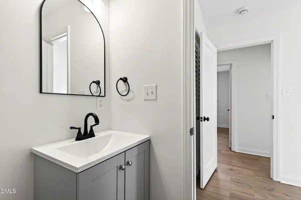 a bathroom with a sink and mirror