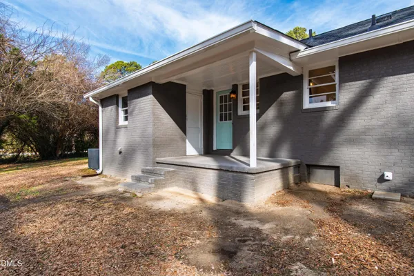 a view of a backyard with a patio