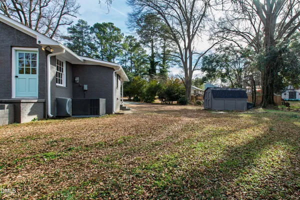 a backyard of a house with lots of green space
