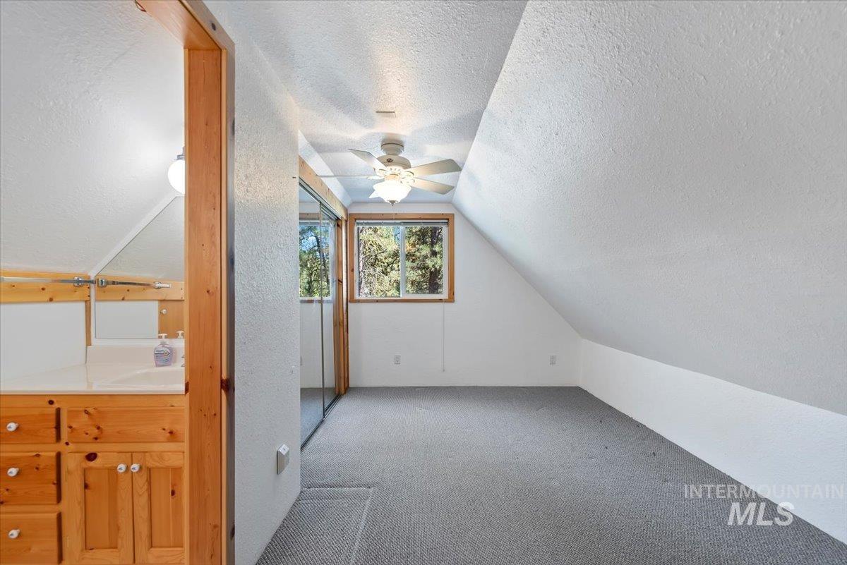 44 Ridgeview Drive Cascade, ID 83611 - Photo 17 of 29 Bonus room with carpet flooring and a ceiling fan