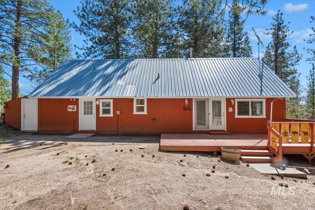 44 Ridgeview Drive Cascade, ID 83611 - Photo 2 of 29 Rear view of property with a metal roof, a wooden deck, and french doors