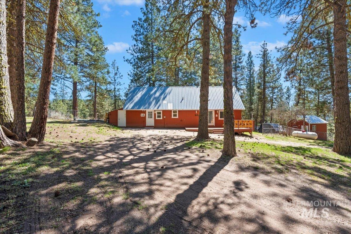44 Ridgeview Drive Cascade, ID 83611 - Photo 29 of 29 View of property exterior with a metal roof and a deck