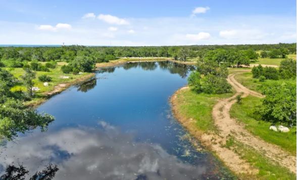 145 Red Hawk Drive Marble Falls, TX 78654 - Photo 27 of 30 a view of a lake with a city
