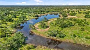 145 Red Hawk Drive Marble Falls, TX 78654 - Photo 28 of 30 a view of a lake with a beach