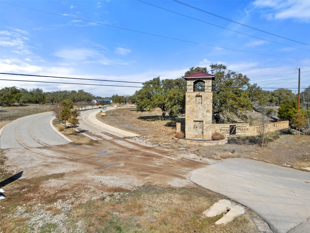 145 Red Hawk Drive Marble Falls, TX 78654 - Photo 8 of 30 a view of a road with a building in the background